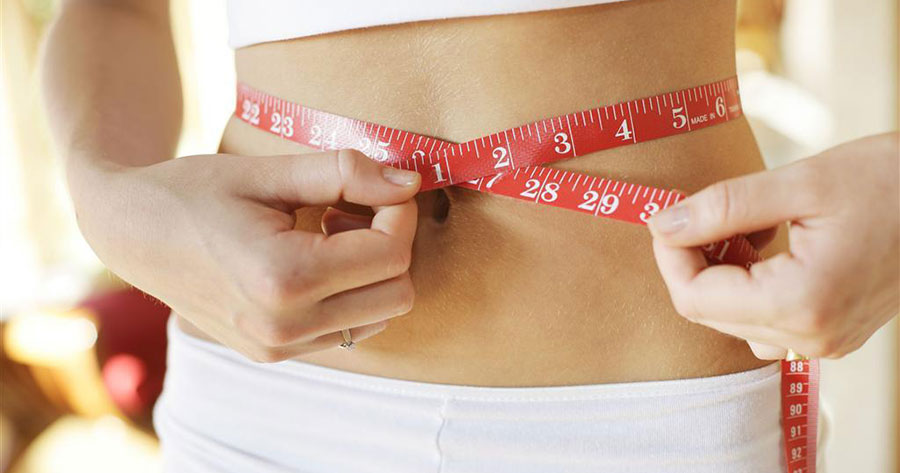 young girl belly waist measurement with tape measure and measure